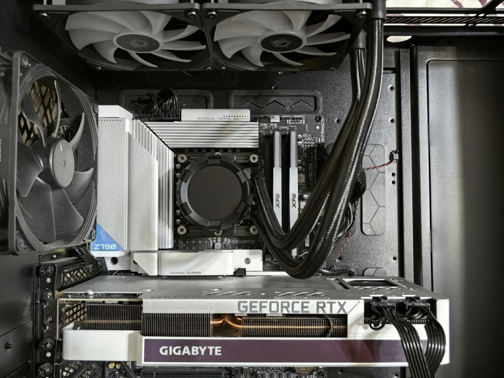 Detailed view of a custom gaming PC's interior showcasing components like RTX GPU and advanced cooling system.